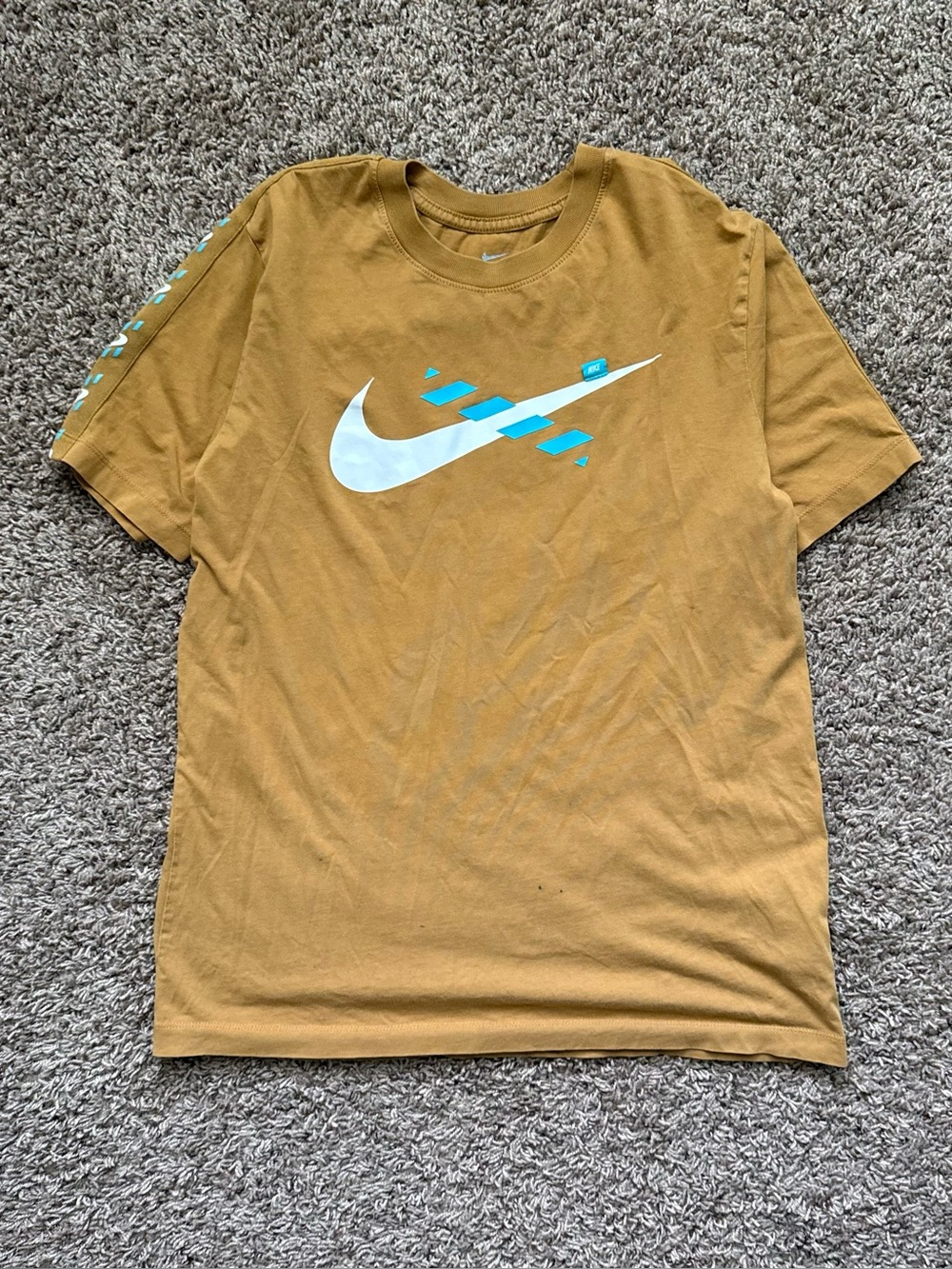 Nike Men's Mustard Yellow Graphic Swoosh Tee with Teal Accents